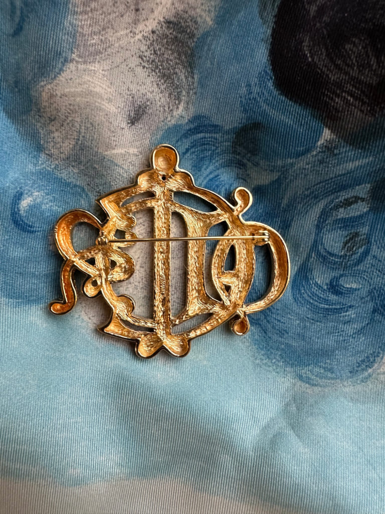 Brooch - logo from the Fashion House Christian Dior
